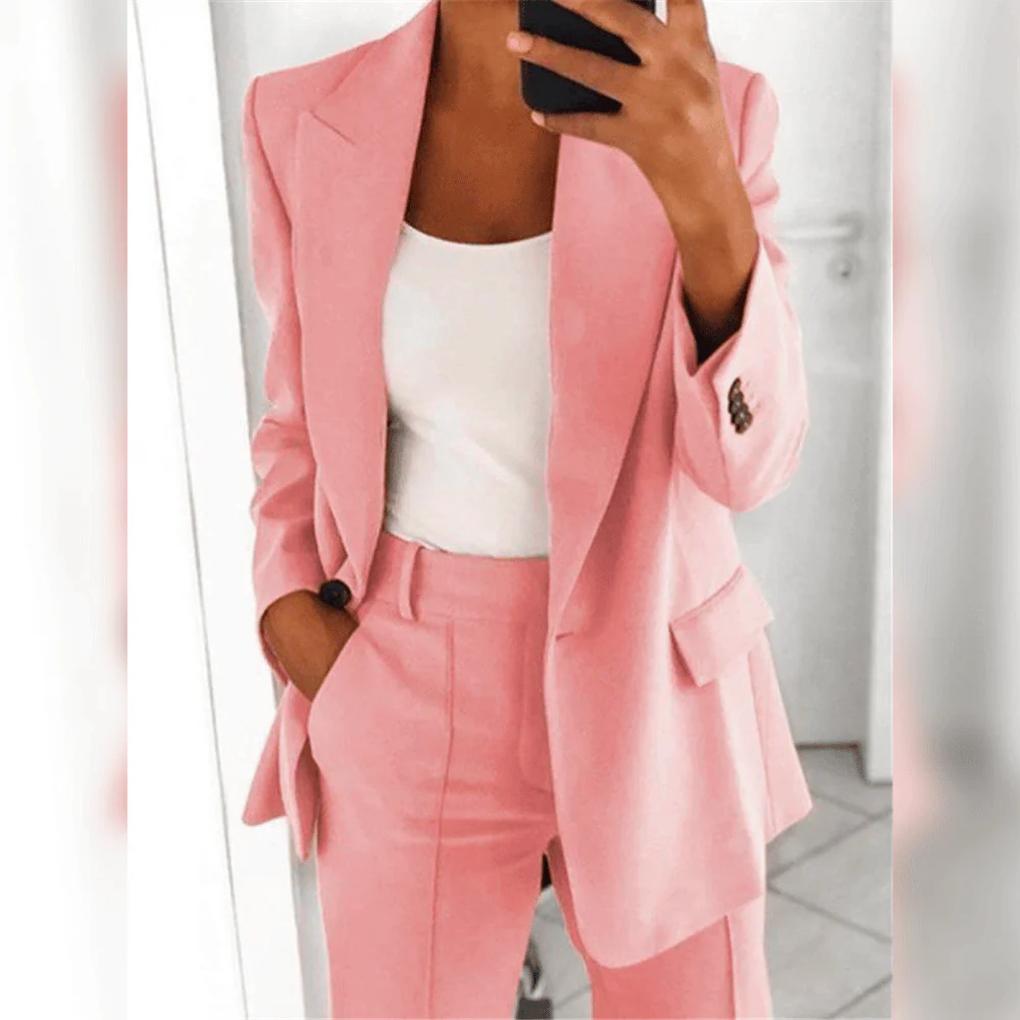 Sophisticated women's 2-piece suit, showcasing elegant design & quality fabric for professional office wear.