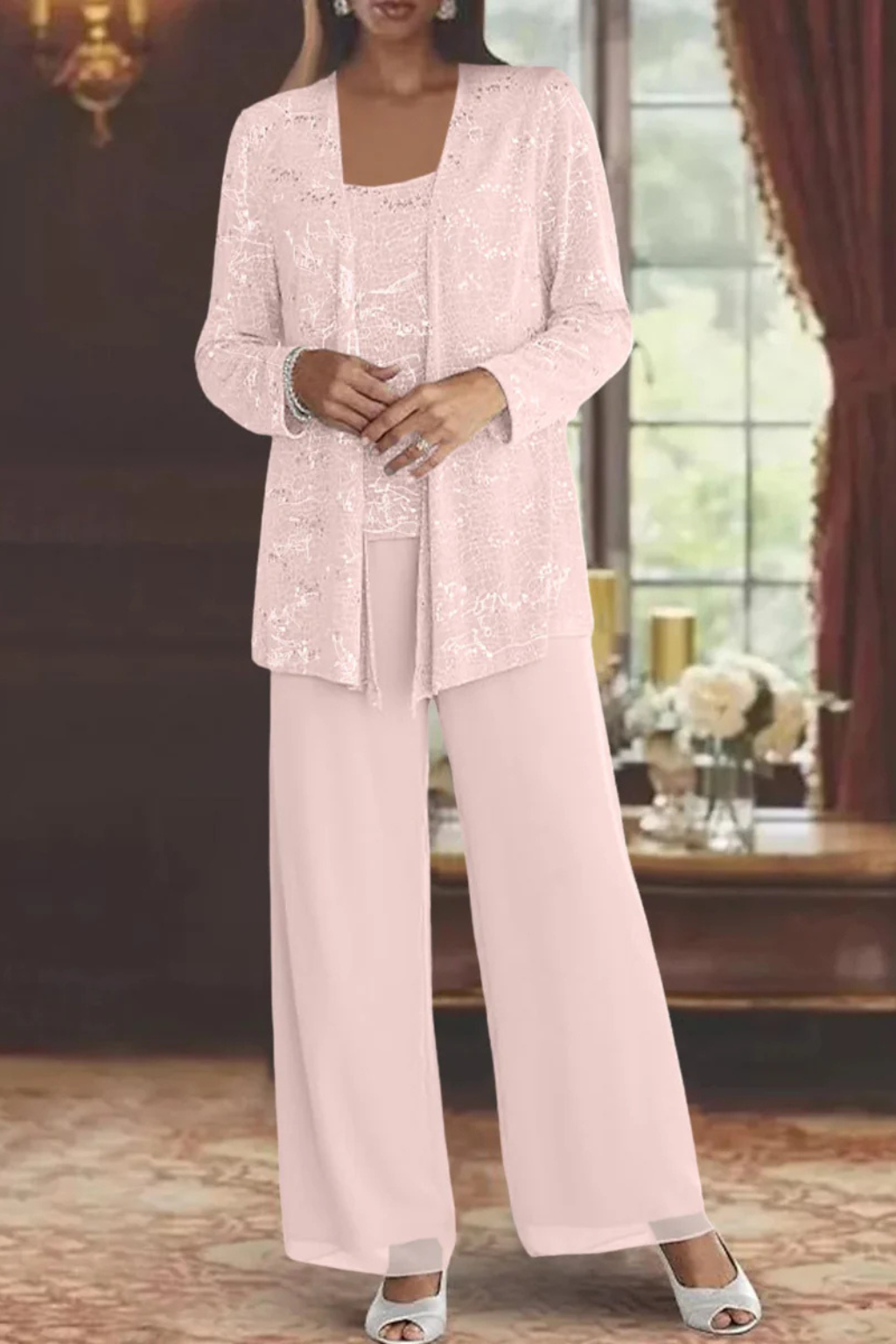 Stylish women's wide leg pant suit with intricate sequin detailing, perfect for a glamorous evening.