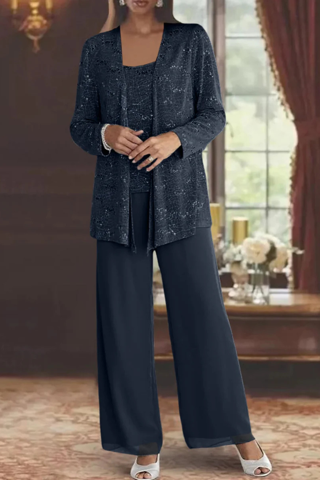 Model wearing a dazzling women's sequin embellished wide leg pant suit for a formal event.