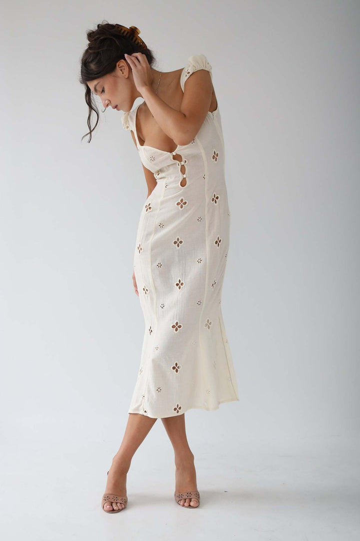 Floral print midi dress with a flowing skirt, perfect for a garden wedding or spring occasion wear.