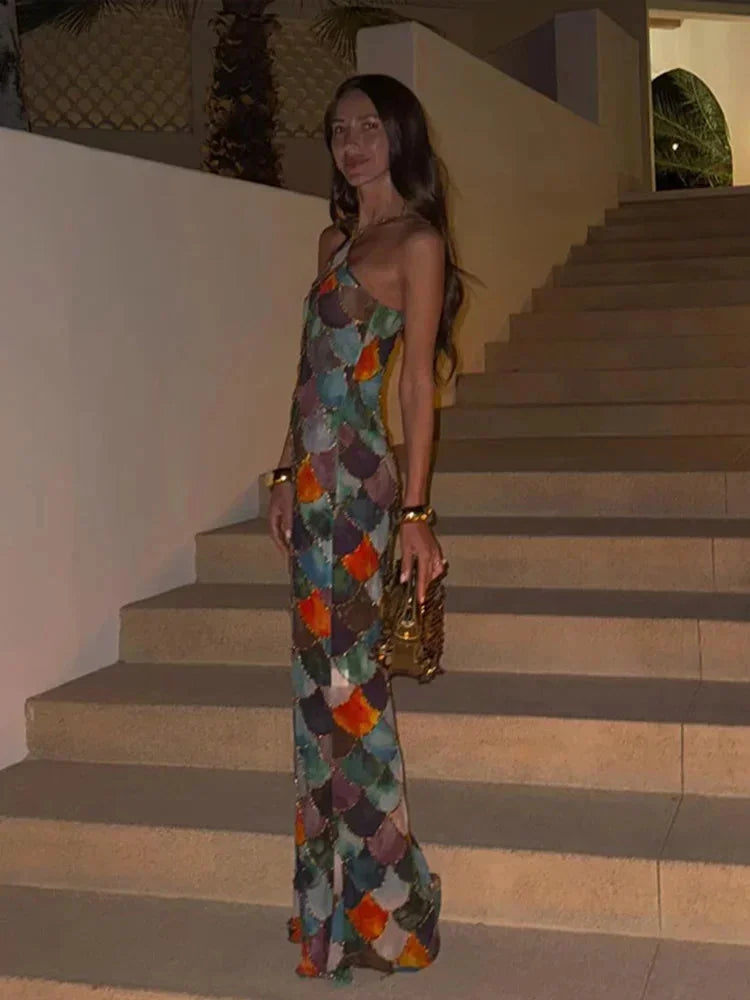 Women's sleek bodycon maxi dress featuring an abstract scale print, halter neck, and backless design for parties.