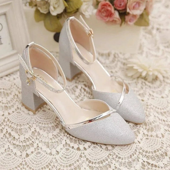 Comfortable women's block heel pumps with ankle strap. Stylish footwear, perfect for all-day wear or special occasions.