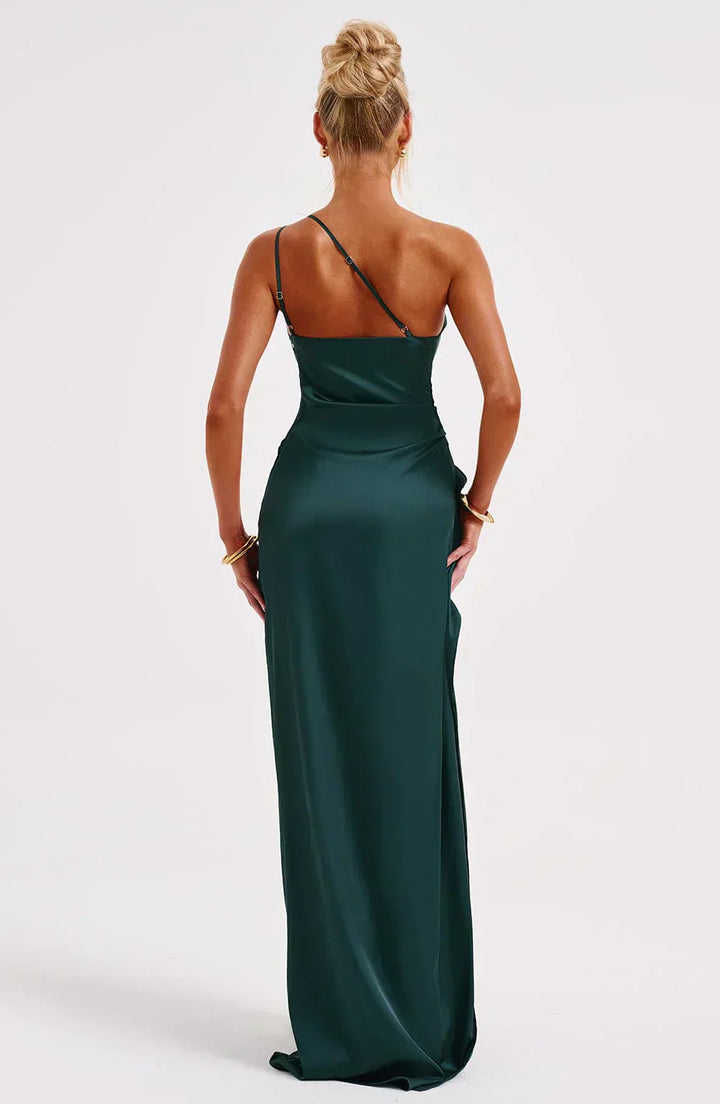 Close-up of the waist and skirt detail of a women's asymmetric maxi dress