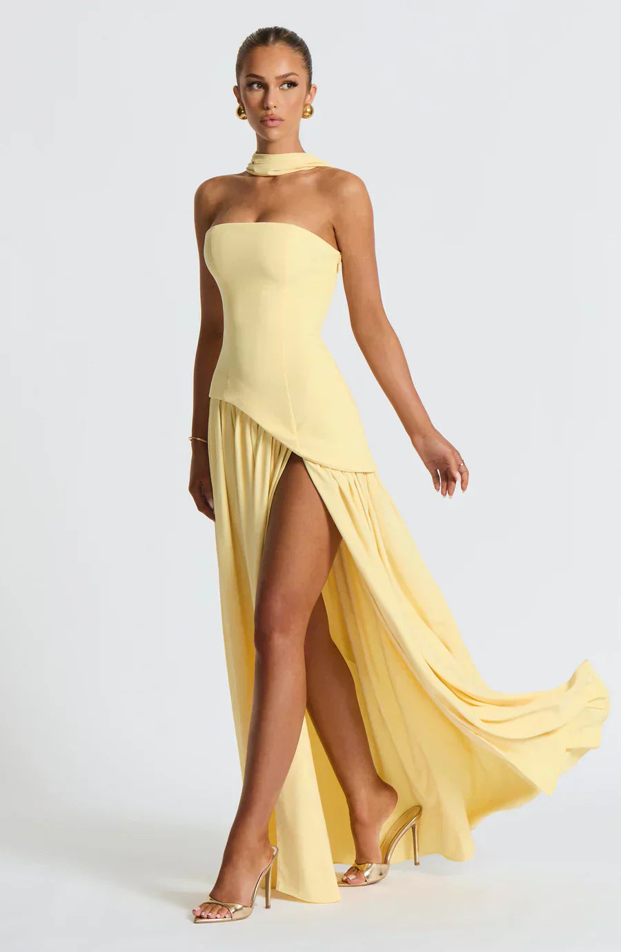 Elegant women's asymmetrical maxi dress in navy, perfect for a wedding guest or formal evening.