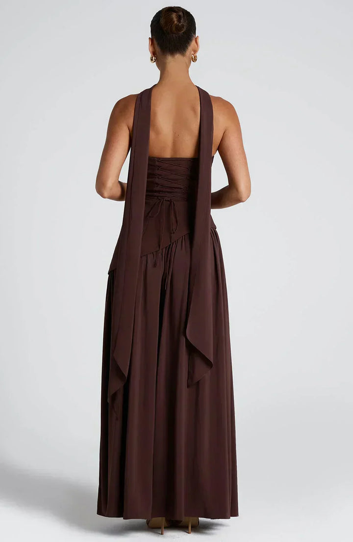 Women's white asymmetric maxi dress, a modern and elegant option for non-traditional wedding guests.