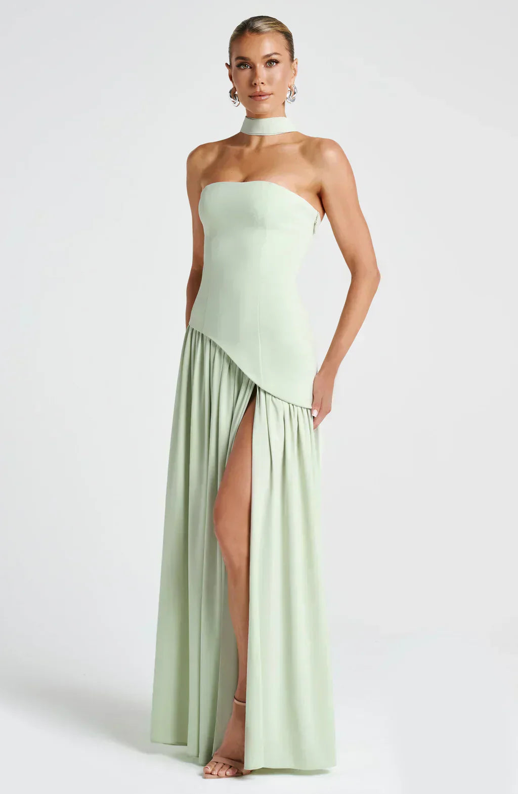 Detailed back shot of women's asymmetric maxi dress, showcasing the flowing fabric and design.