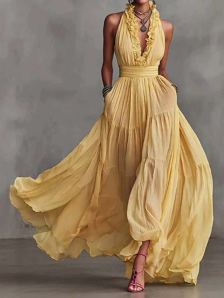Elegant women's backless maxi dress with ruffle trim & plunging neckline, perfect for evening or wedding guest.