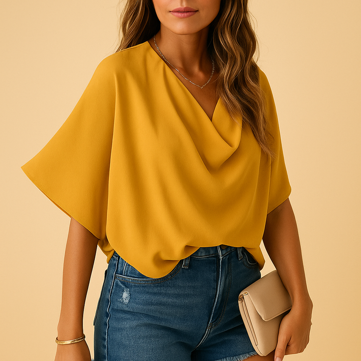 Flowy batwing sleeve women's blouse with a chic V-neck design, offering an elegant relaxed fit for any occasion.