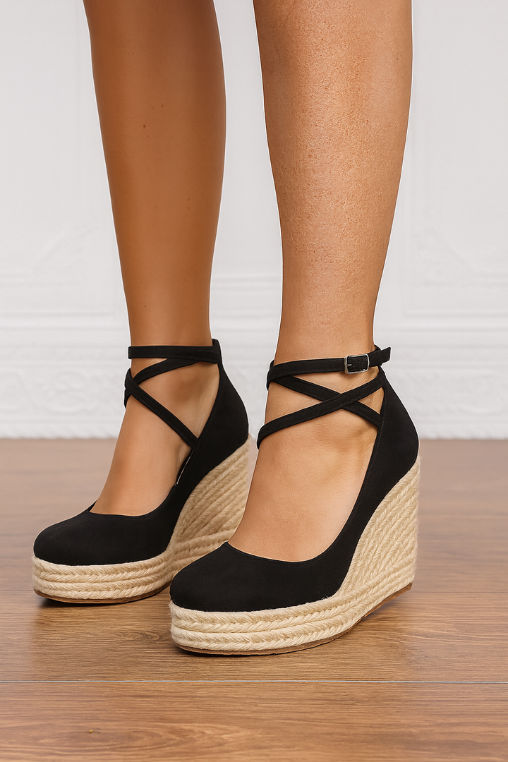 Elegant women's beige wedge platform heels with cross-strap detail, perfect for summer fashion and comfortable wear.