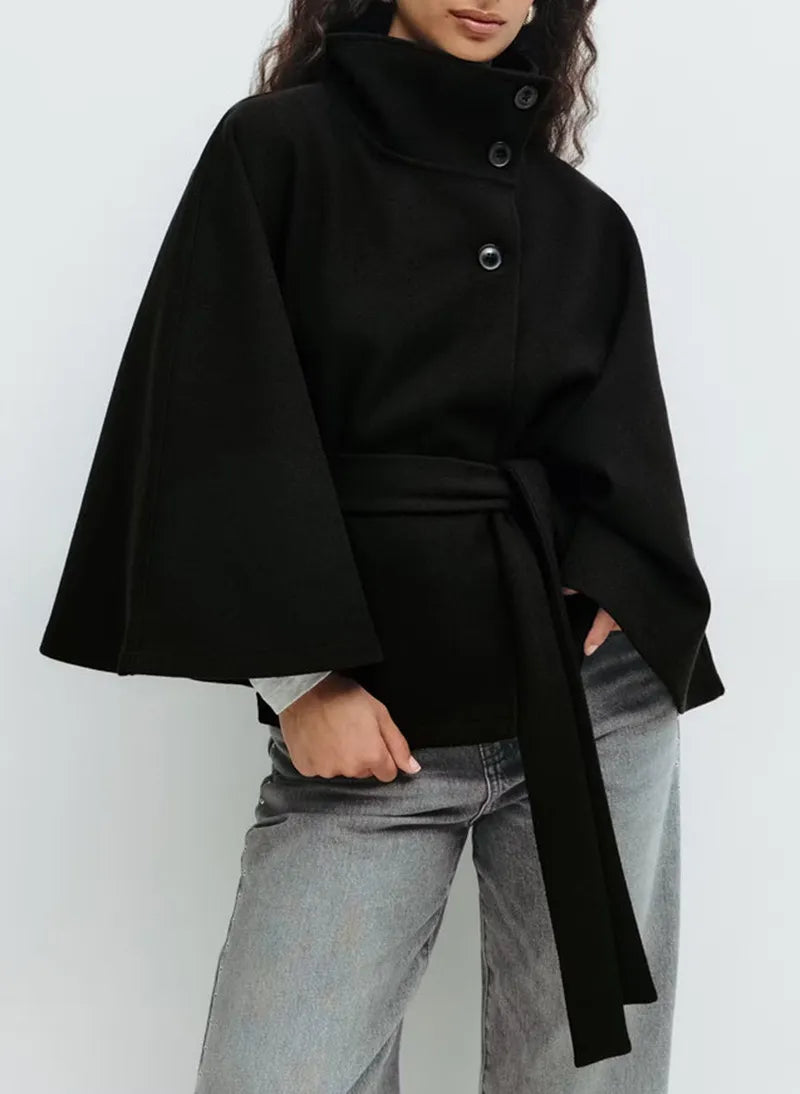 Women's elegant spring coat: a belted high-neck cape offering both warmth and chic fashion.
