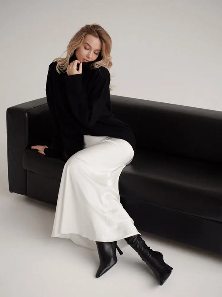 Formal full-length high-waist fishtail maxi skirt for elegant evening ensembles.