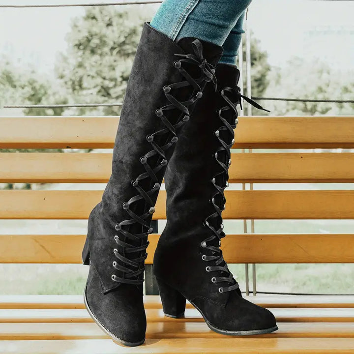 Women's knee-high lace-up block heel boots in rich brown, ideal fashion boots for a chic winter look.
