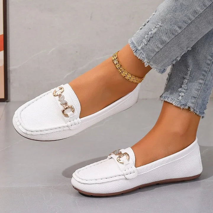 Faux leather slip-on loafers for women, featuring a stylish crystal chain embellishment.
