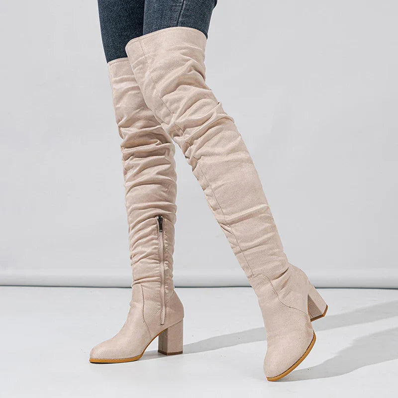 Stylish women's tall heeled boots in a rich black suede effect, showcasing a sleek design