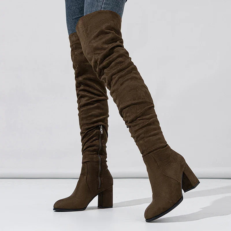 Full-length view of women's suede effect heeled boots, ideal for cold weather and fashion