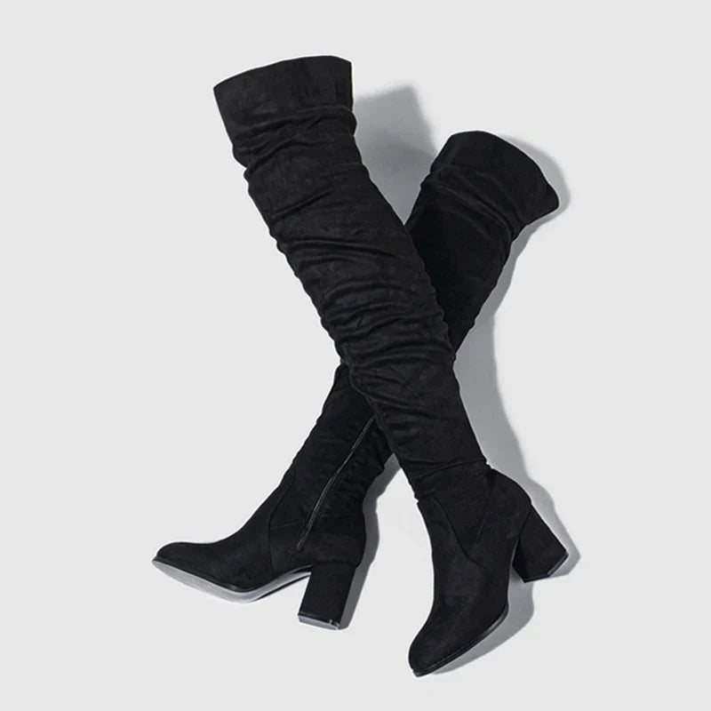 Detailed shot of the shaft of women's over-the-knee boots, emphasizing the soft suede texture