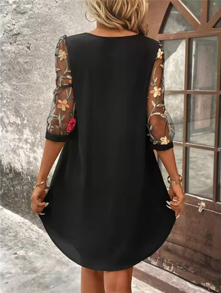 Versatile women's black V-neck floral dress with sheer sleeves, ideal for summer style or a sophisticated occasion.
