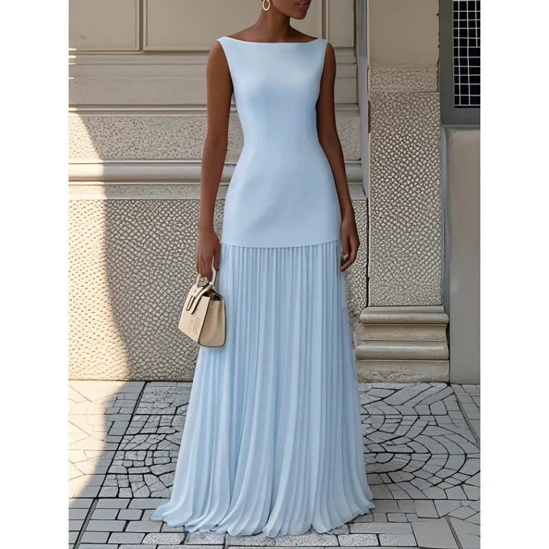Chic sleeveless maxi dress for women featuring a boat neck & flowing pleated skirt. Comfortable & elegant summer wear.