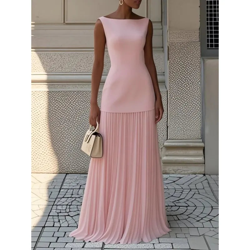 Sophisticated women's boat neck maxi dress. Elegant pleated skirt creates a flowing, flattering silhouette.