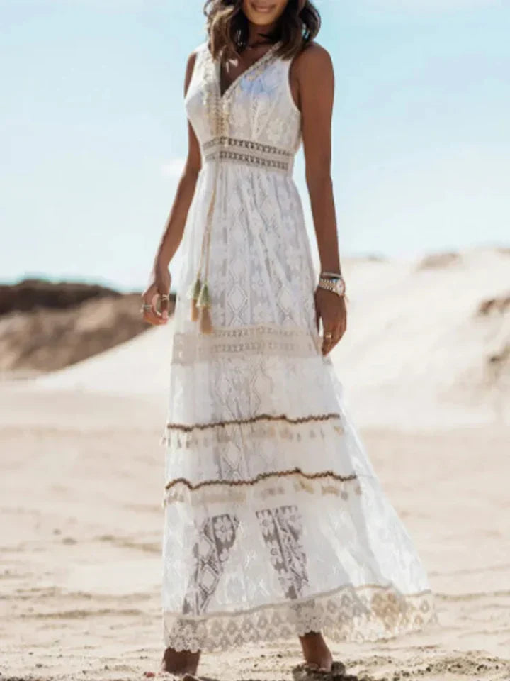 Full-length view of a women's elegant bohemian long maxi dress with stunning lace and stylish flared sleeves.
