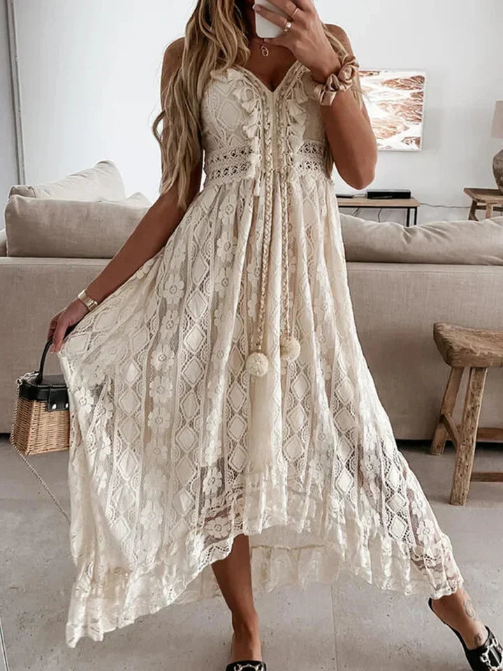 Beautiful women's summer bohemian maxi dress in white with intricate lace details & fashionable flared sleeves.