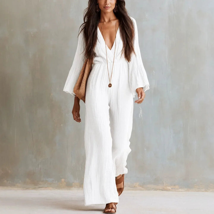 Elegant women's boho wide leg jumpsuit featuring a deep V-neck and stylish flare sleeves, perfect for summer vacation.