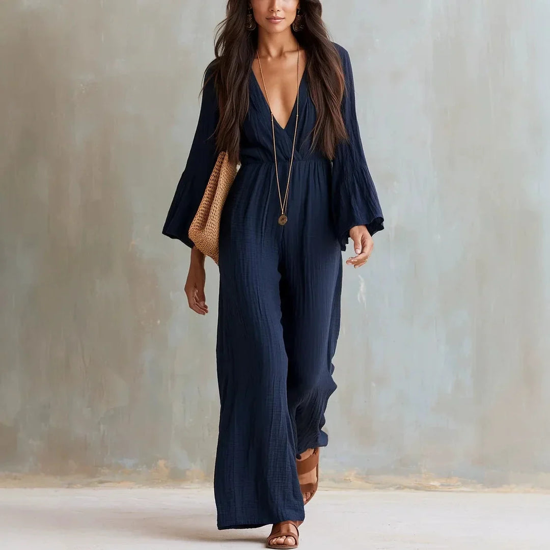Chic bohemian wide leg jumpsuit for women with a flattering V-neckline and trendy flare sleeves for casual or evening.