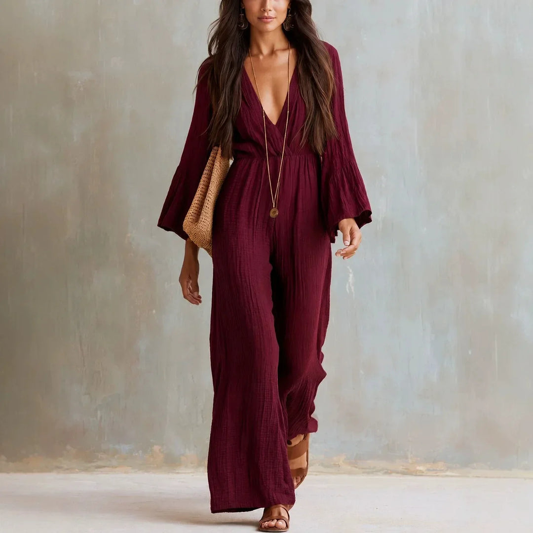Women's comfortable one-piece boho jumpsuit, wide leg design, deep V-neck, and elegant flare sleeves for spring fashion.