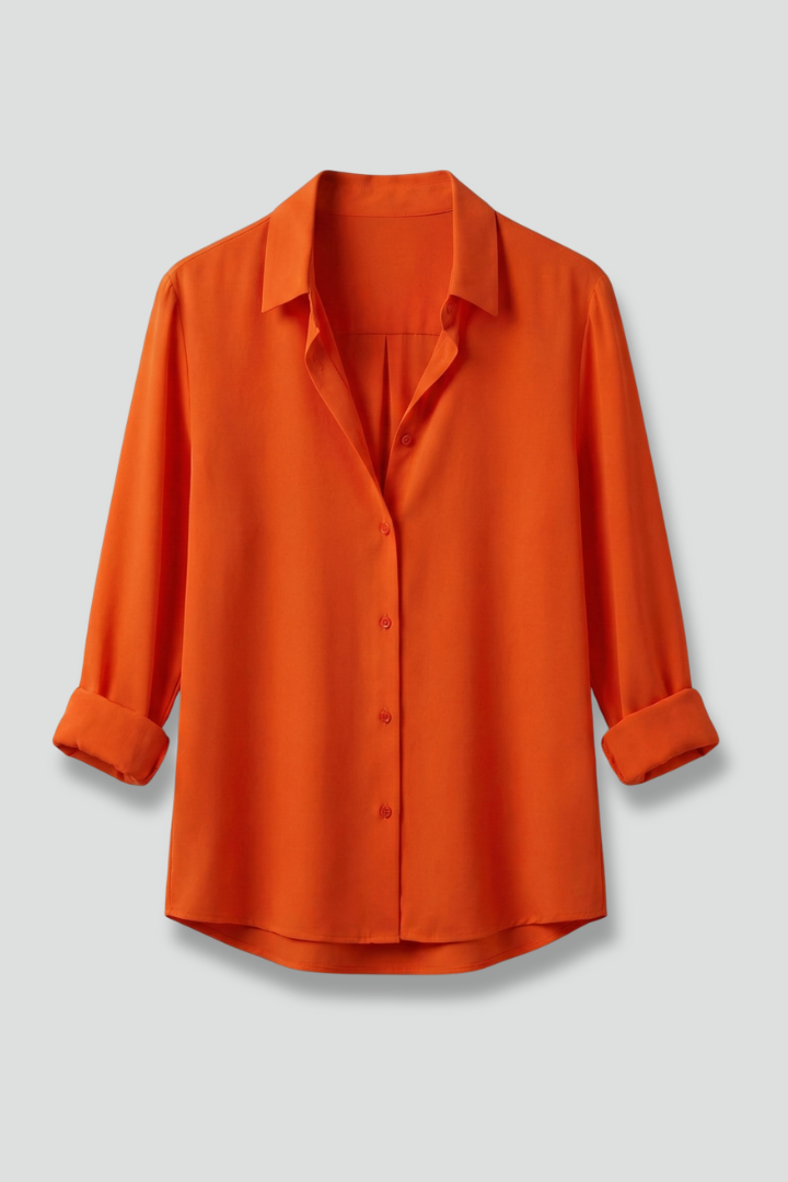 Elegant women's button-down blouse with classic collar, long sleeves. Versatile top for office or casual chic.