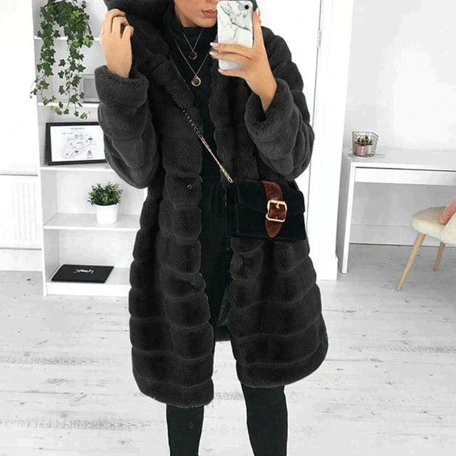 Stylish women's faux fur coat with elegant button-down closure, a fashionable and warm winter outerwear.