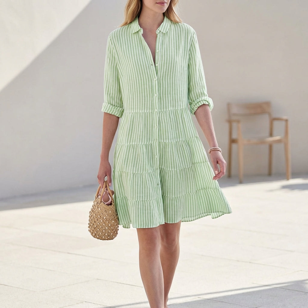 Elegant women's button-down tiered mini dress with V-neck and 3/4 sleeves, perfect for spring/summer fashion.