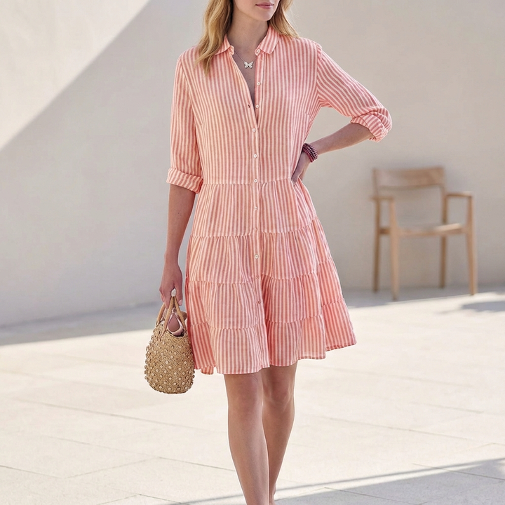Versatile elegant mini shirt dress for women, featuring a button-down front, tiered skirt, and 3/4 sleeves.