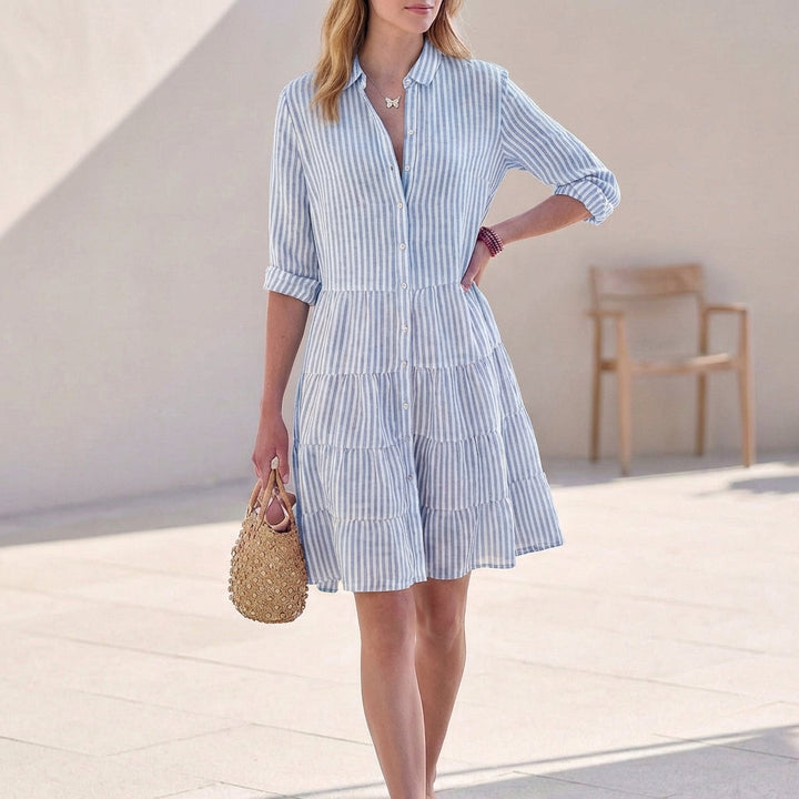 Stylish women's button-down mini dress with a charming tiered skirt, V-neck, and comfortable 3/4 sleeves.
