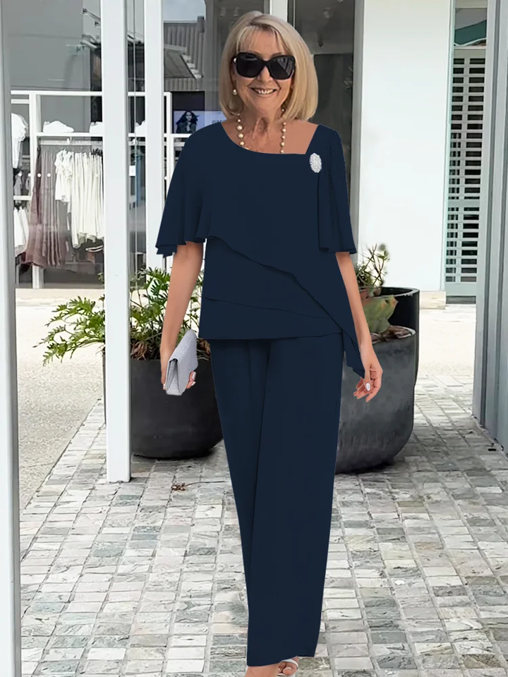 Stylish women's cape top and straight leg trousers two-piece set. Comfortable & elegant for occasion wear.