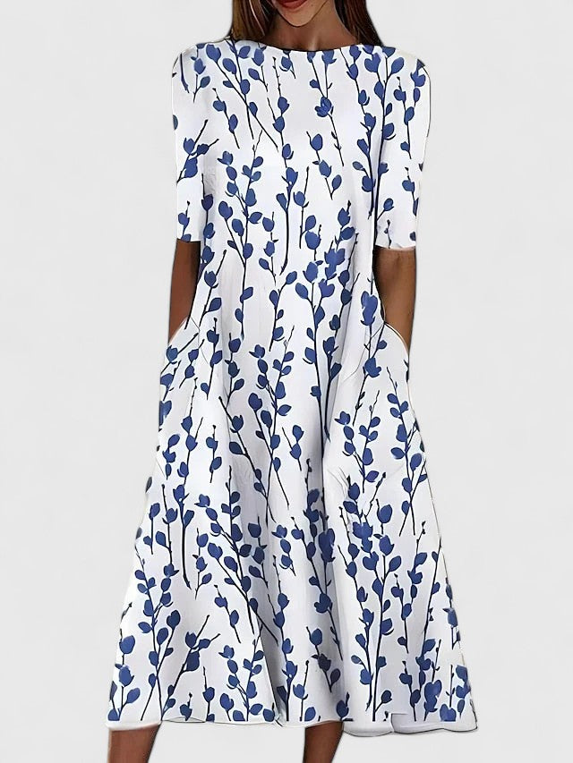 Elegant Women's Cianne Chic Midi Dress with boat neck, fit and flare design, and pockets, ideal for spring & summer.