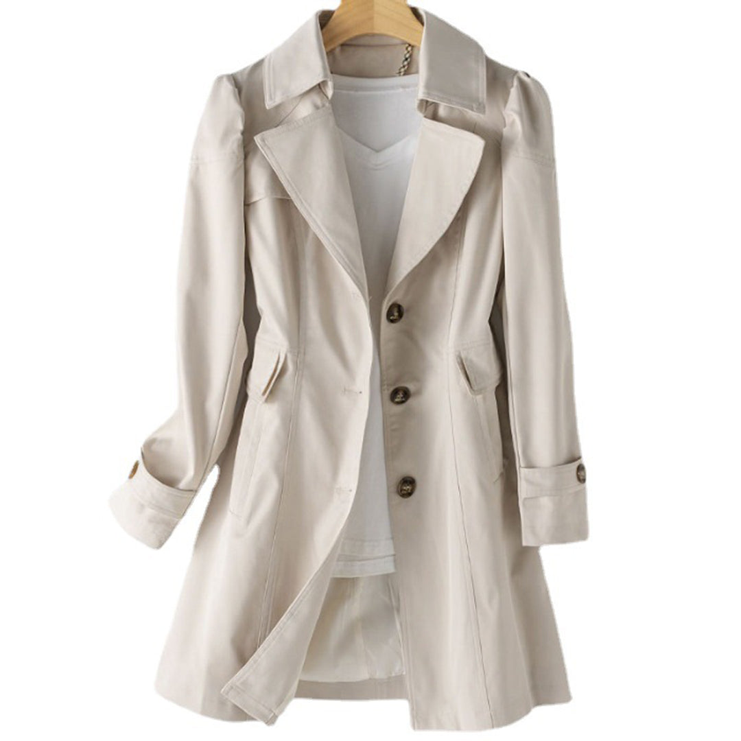 Fashionable women's double-breasted trench coat, a classic jacket for an elegant look in cooler weather.