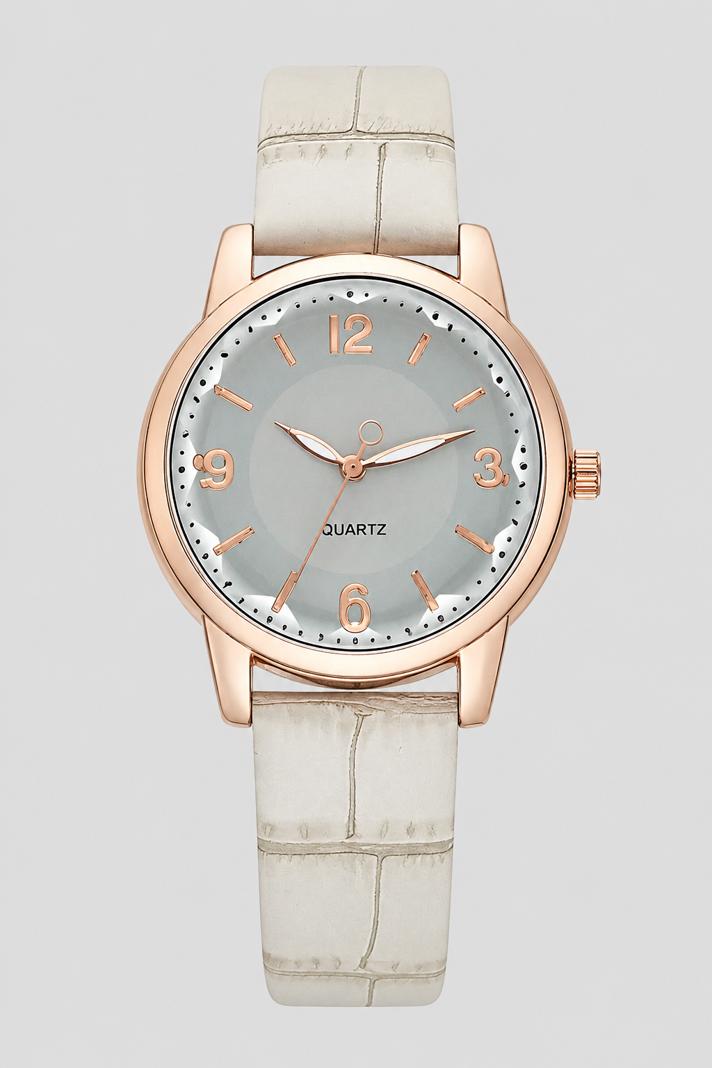 Close-up of a women's classic watch, highlighting the elegant embossed leather strap and minimalist dial. Fashion accessory.