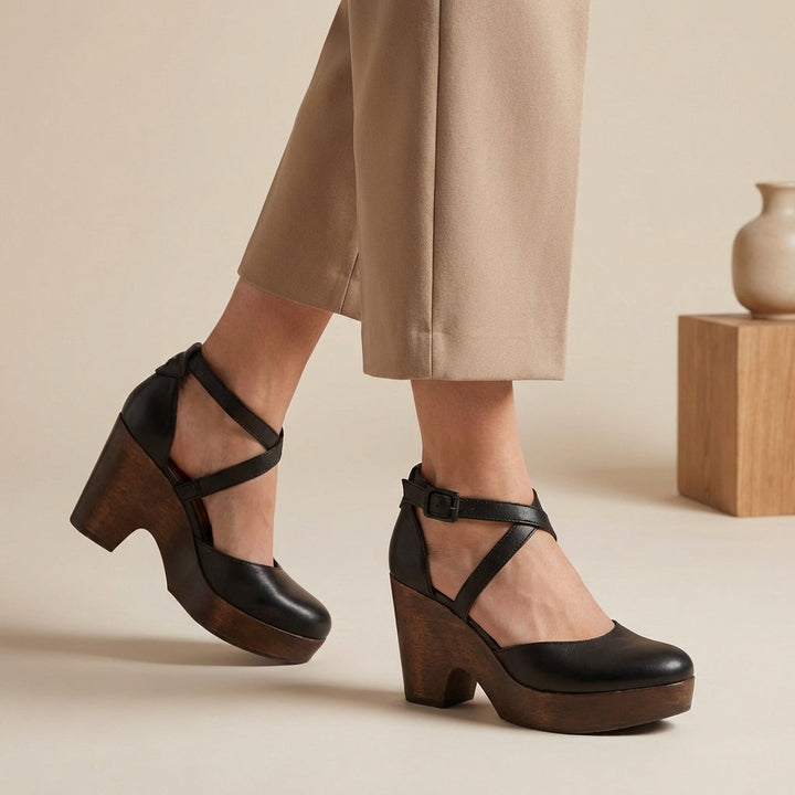 Elegant women's closed-toe block heel pumps with an ankle strap, perfect for formal occasions.