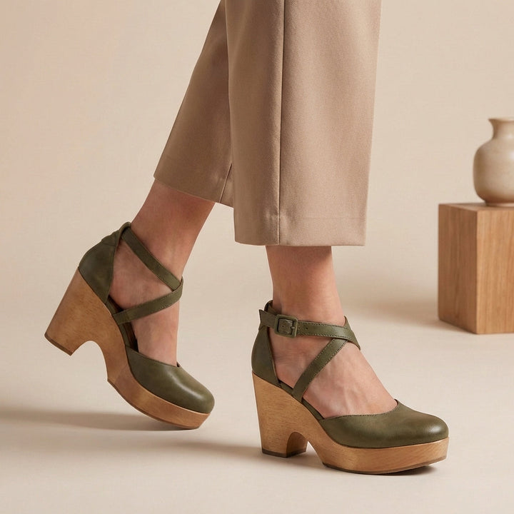 Classic round-toe women's pumps featuring a sturdy block heel and elegant ankle strap, ideal for work or events.