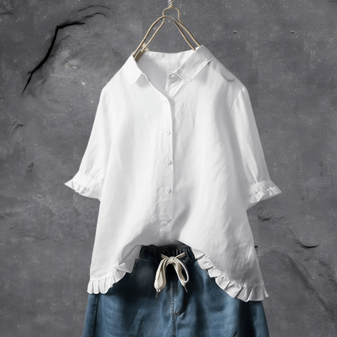 Feminine collared blouse for women, featuring a stylish ruffled hem & button front, ideal for elegant spring fashion.