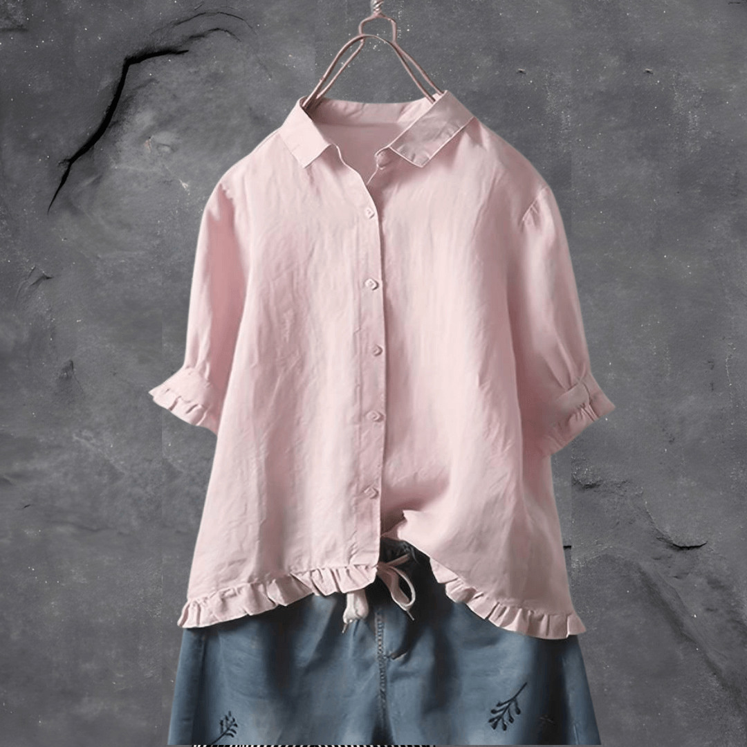 Chic women's short sleeve collared top with elegant ruffled hem. A versatile button-front blouse for any stylish occasion.