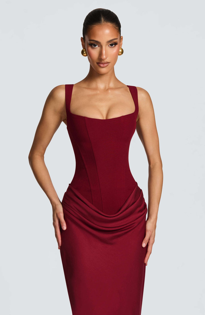 Modern women's corset maxi dress with a sleek square neck, perfect for elegant wedding guests.