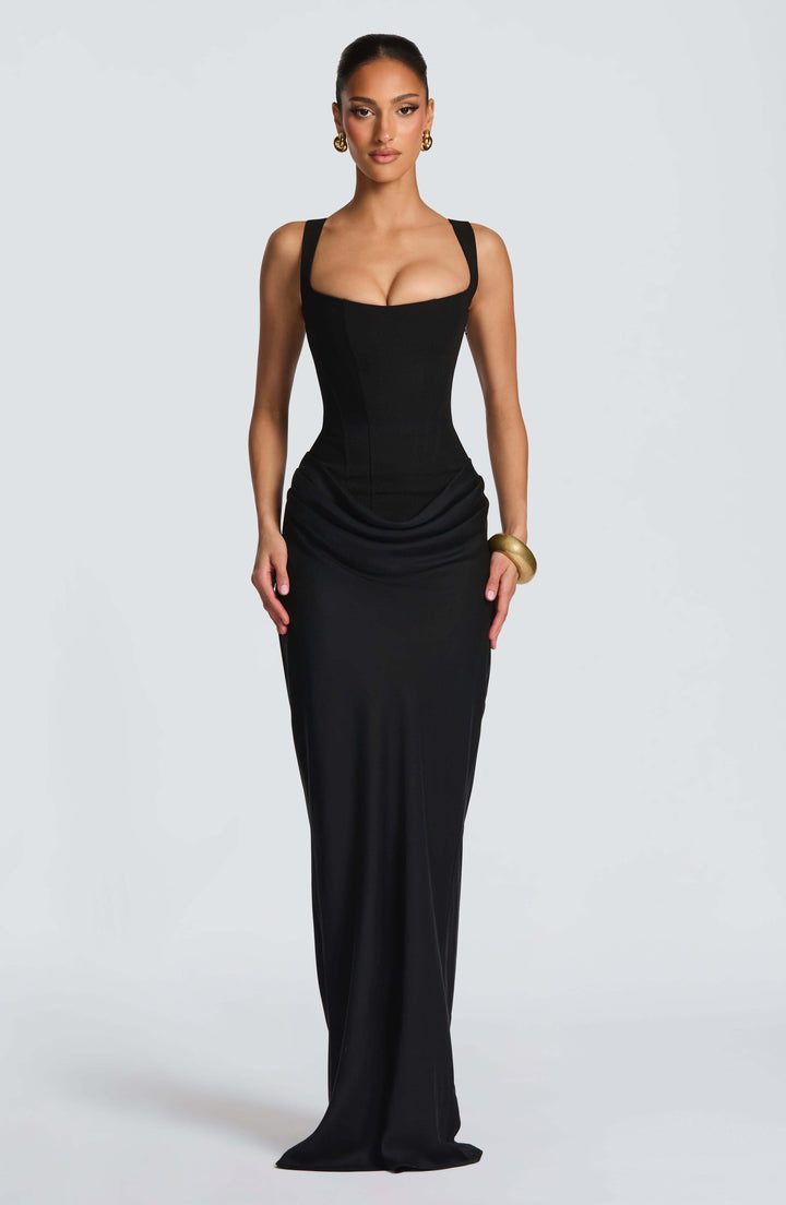 Women's elegant wedding guest dress showcasing a corset bodice and alluring lace-up back.