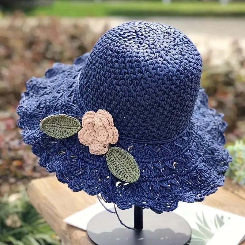 Stylish women's beach accessory, a crochet straw sun hat with an eye-catching ruffle.
