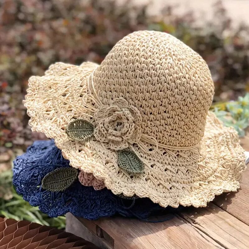 Fashionable women's straw sun hat with a beautiful crochet pattern and distinct ruffle detail.