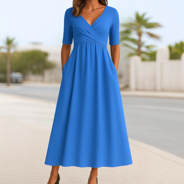 Women's casual spring/summer midi dress. Features a crossed V-neck, short sleeves, and elegant flared skirt.