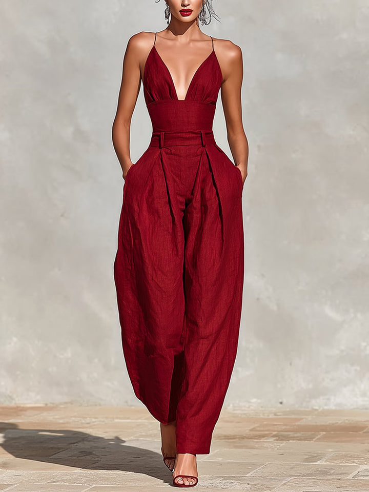Elegant women's deep V-neck sleeveless wide leg formal jumpsuit for special occasions.