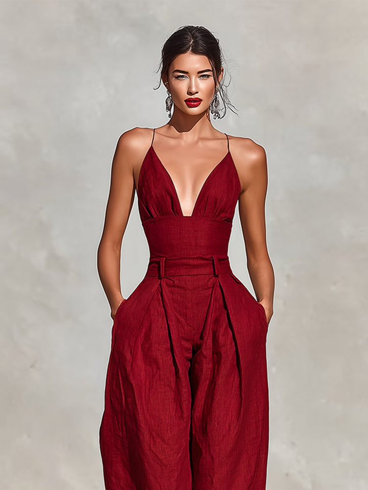 Sophisticated green wide leg formal jumpsuit with deep V-neck, ideal for resort & vacation wear.