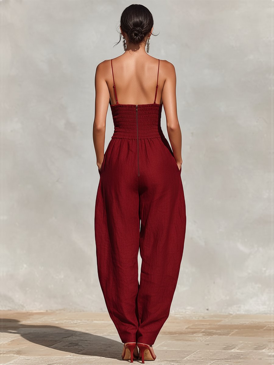 Stylish deep V-neck wide leg jumpsuit, an elegant women's outfit for formal dinners & resort fashion.