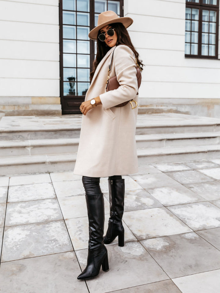 Stylish beige double-breasted trench coat for women, perfect for elegant winter outerwear.